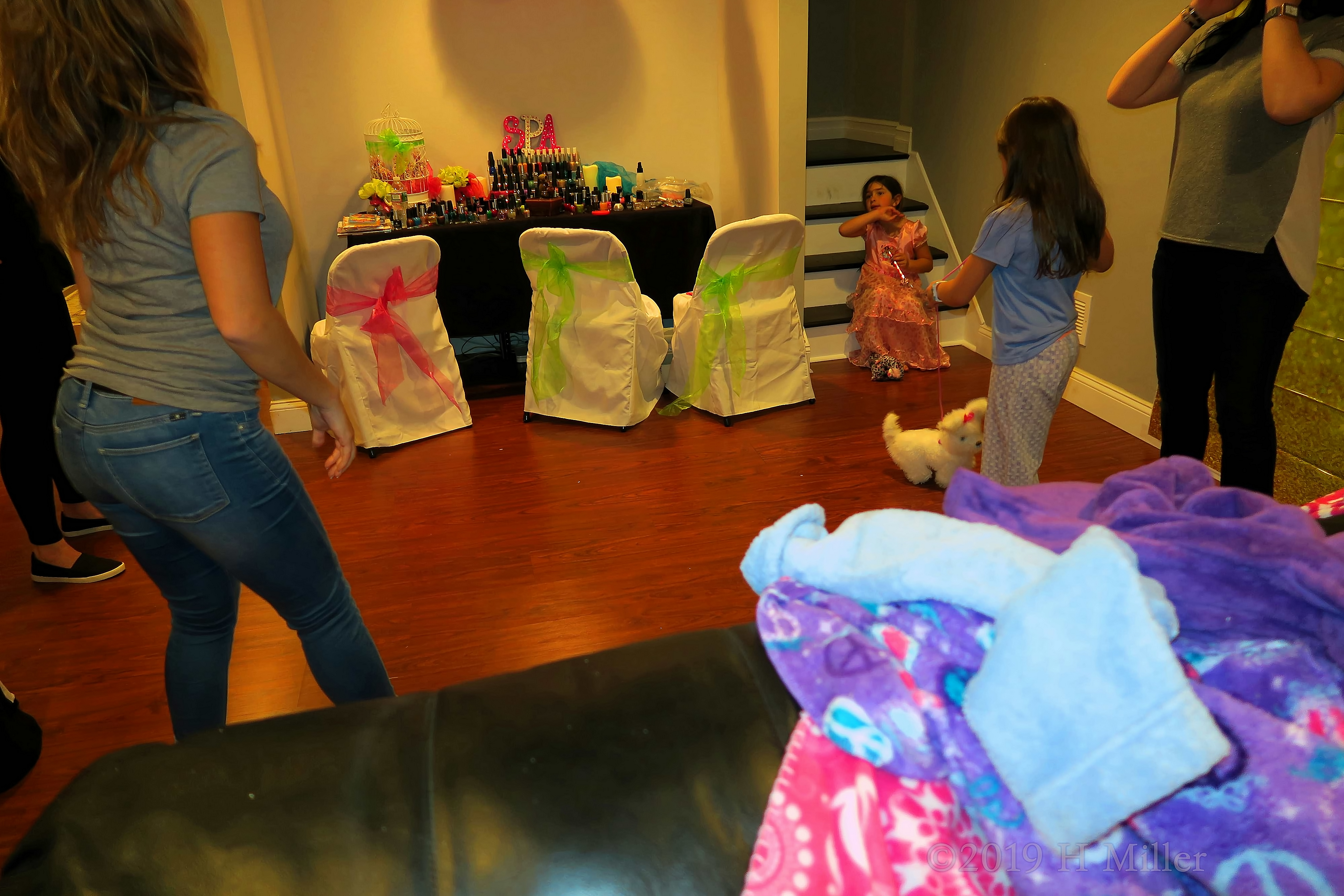 Girls Are Playing With The Cute Little Dog Girls Are Playing With The Cute Little Dog