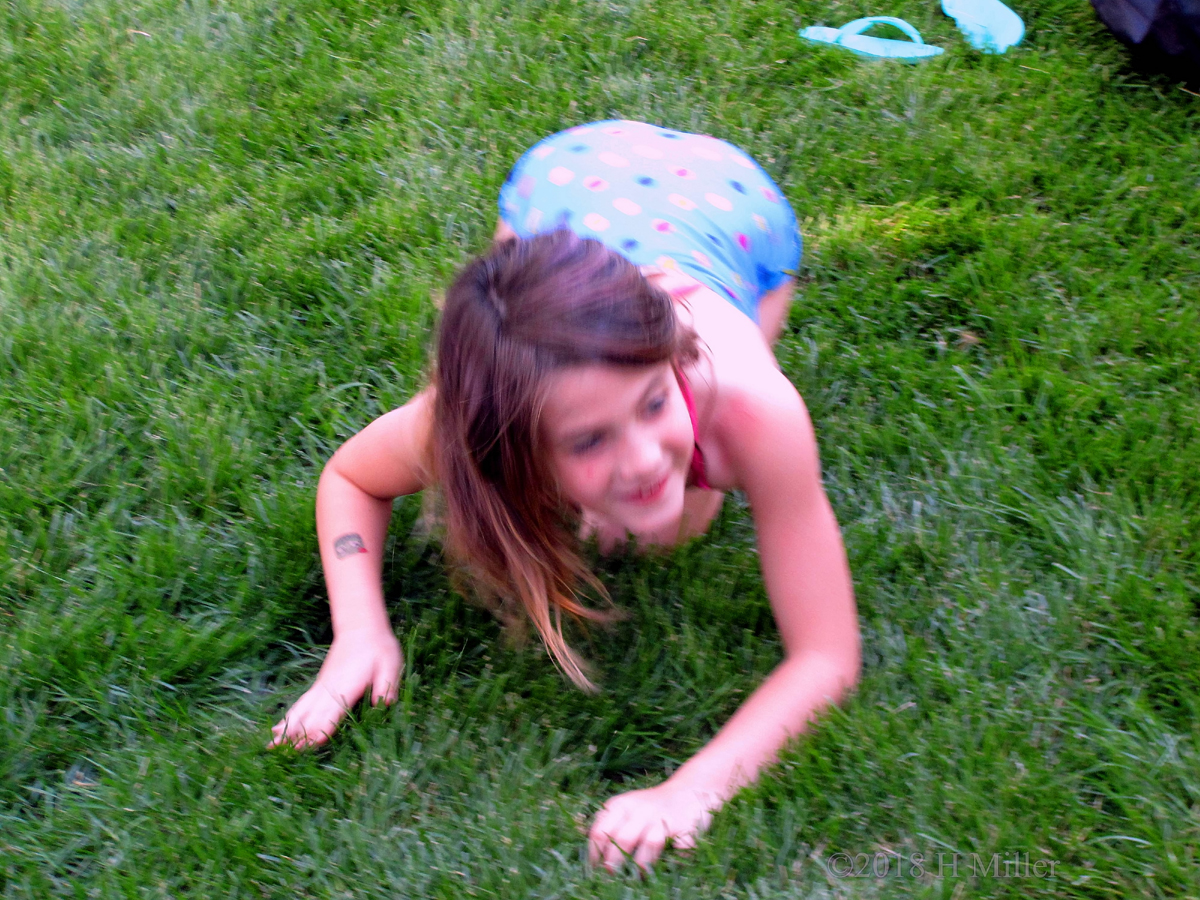 Party Guest Is Crawling And Playing Hide And Seek In The Grass