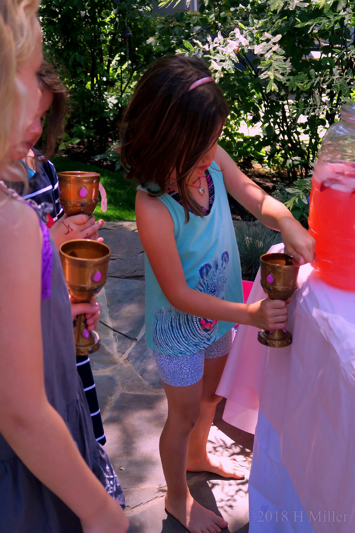 Pouring Pink Lemonade Into Goblet 