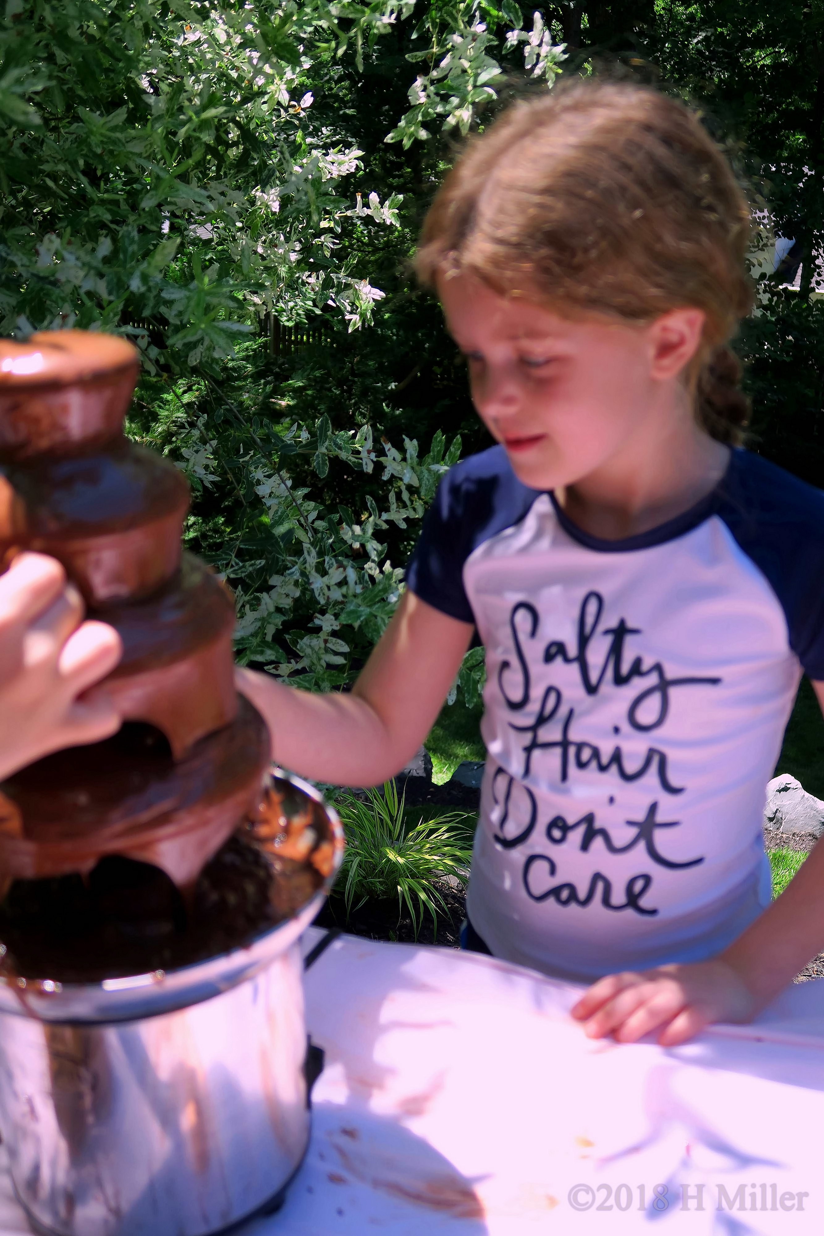 Enjoying Eating From The Chocolate Fountain 