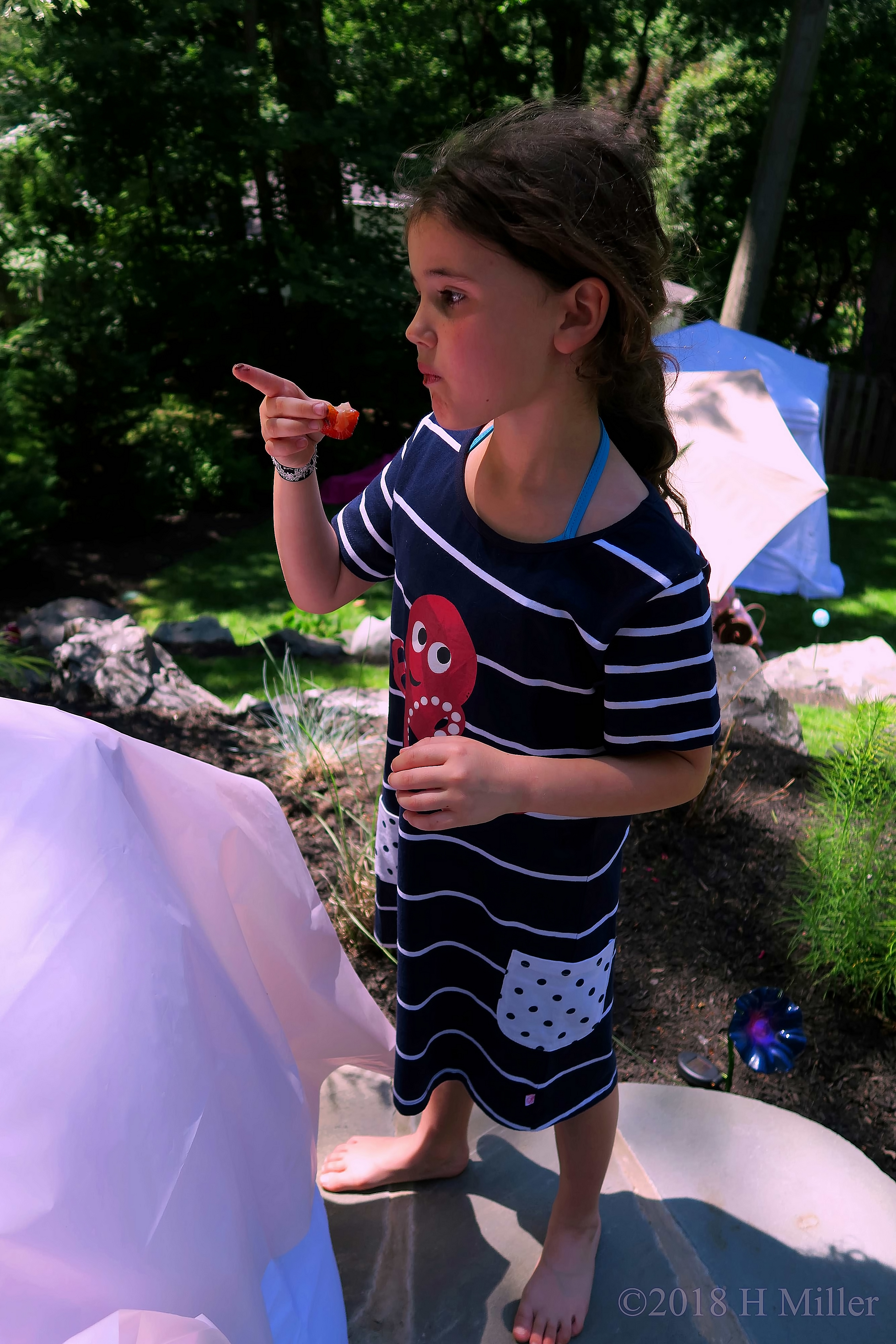 She Is Eating Strawberries Dipped In Chocolate Fondue 