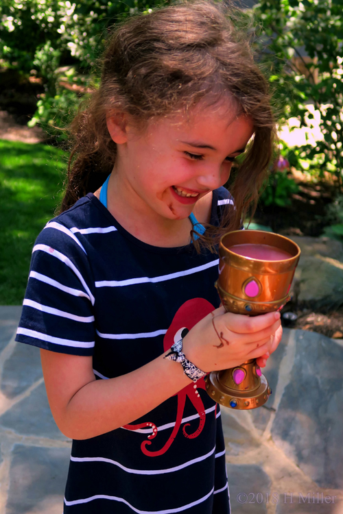 Enjoying Her Goblet Of Pink Lemonade