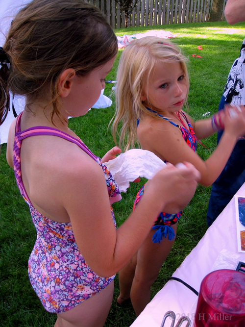 Party Guests Experimenting With Kids Craft Creation