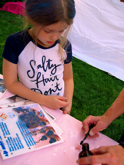 Party Guests Learning To Make Lip Balm During Crafts For Kids