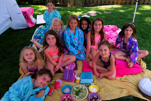 Smiling Group Photo In Spa Robes