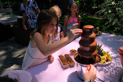 What Fun Dipping Fruit Into The Chocolate Fountain! What Fun Dipping Fruit Into The Chocolate Fountain!