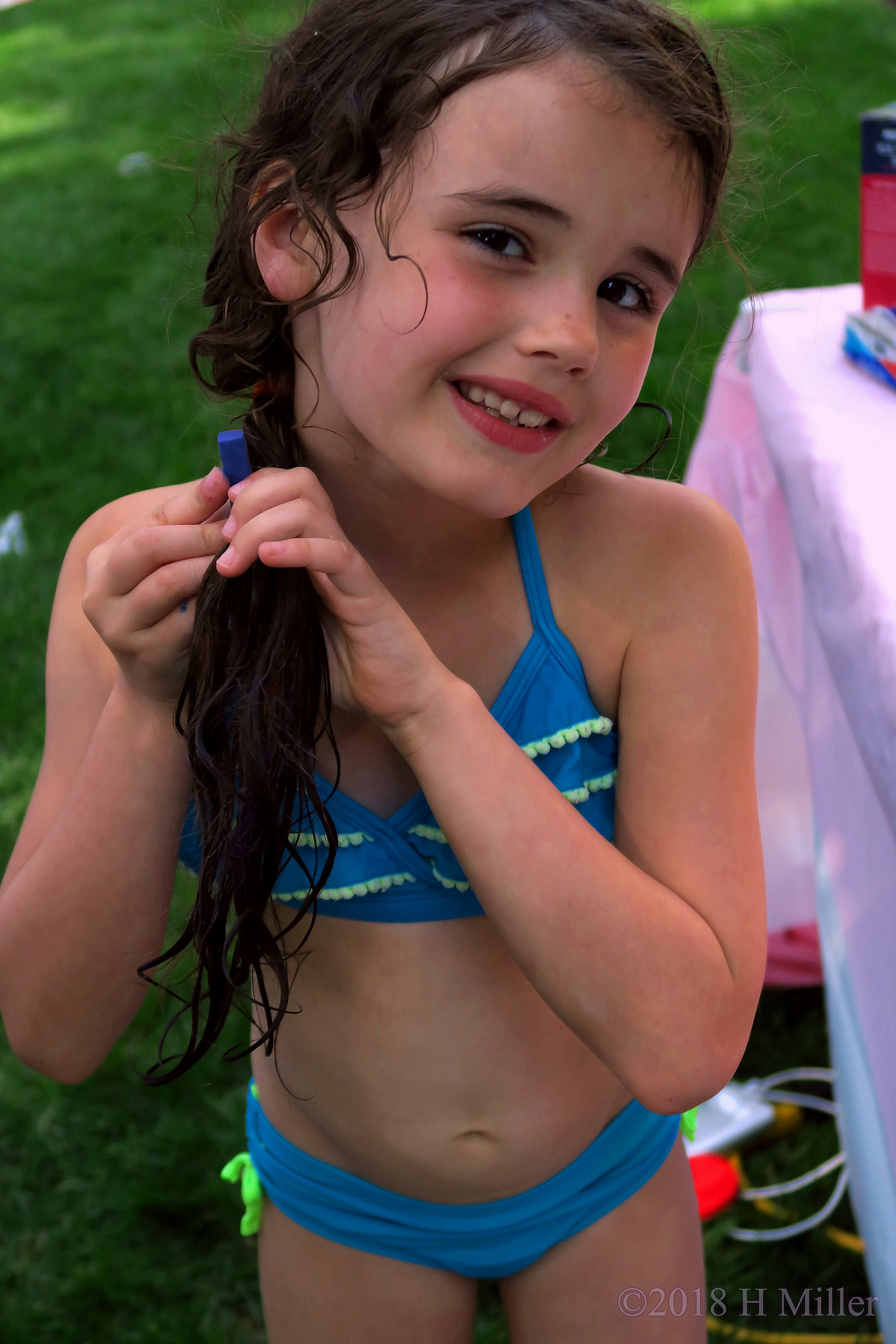 Birthday Girl Playing With Hair Chalk. 