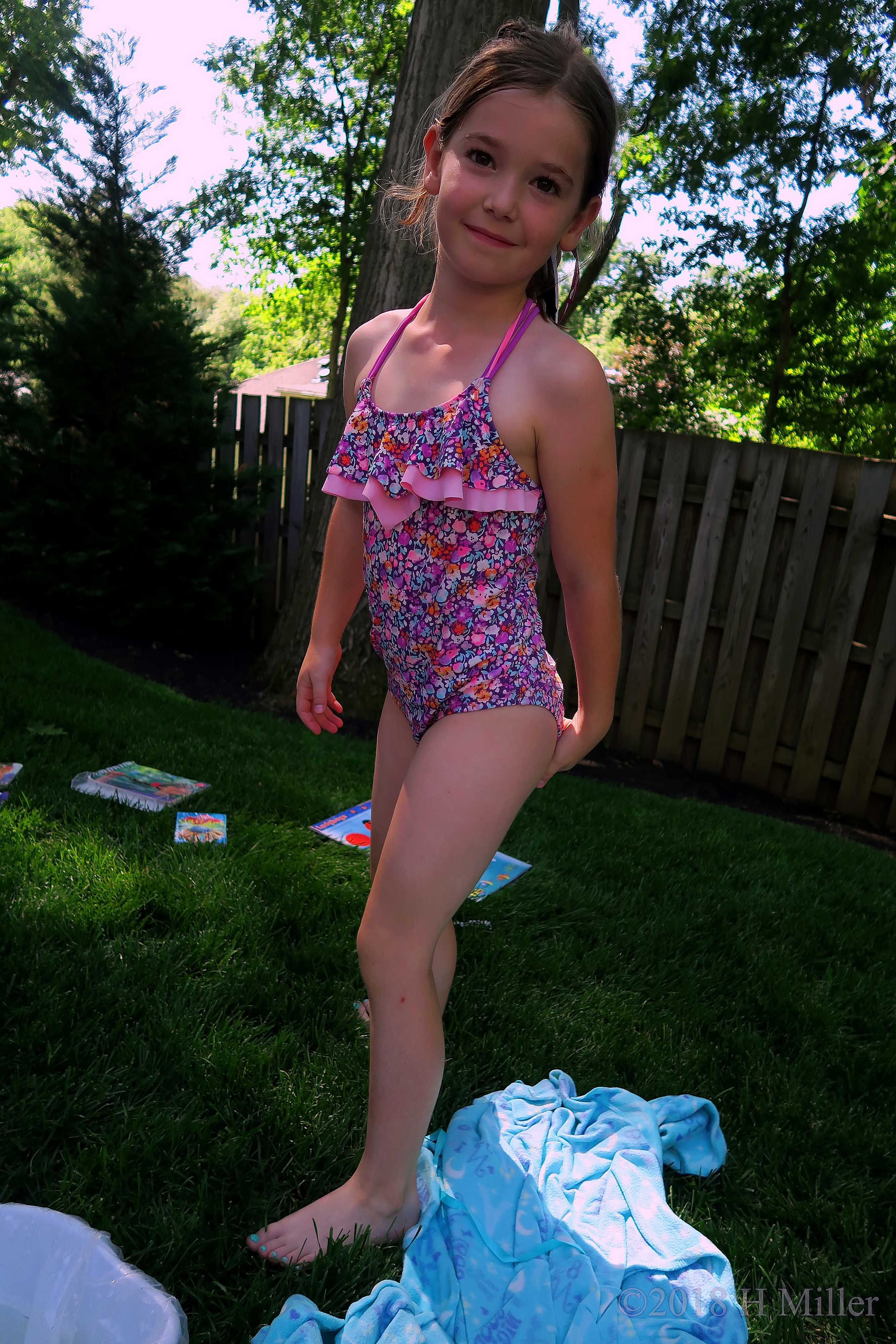 Posing With Her Teal Blue Girls Pedicure 