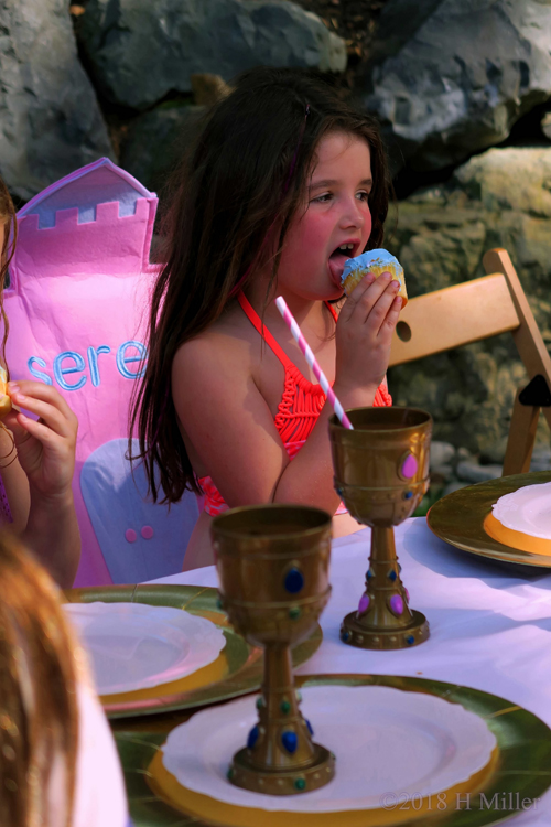 Birthday Girl Eating Blue Birthday Cupcake Birthday Girl Eating Blue Birthday Cupcake