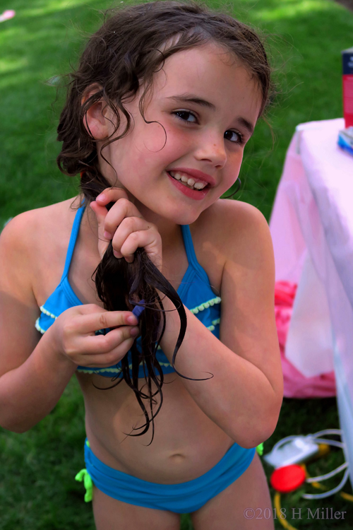 Birthday Girl Playing With Hair Chalk Trying To Get Her Hair Blue.