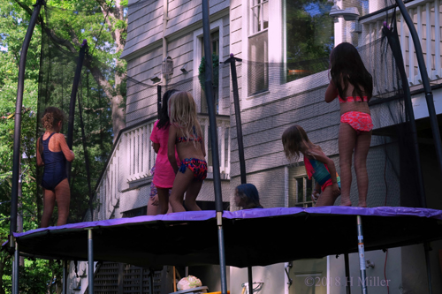 Party Guests Jumping On The Trampoline Party Guests Jumping On The Trampoline