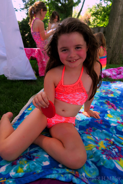 Posing In A Neon Coral Swimsuit Posing In A Neon Coral Swimsuit