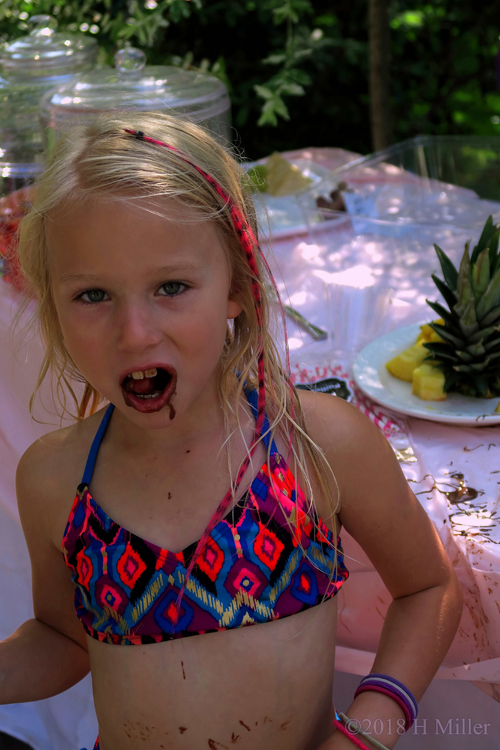 Spa Party Guest Eating Chocolate Spa Party Guest Eating Chocolate