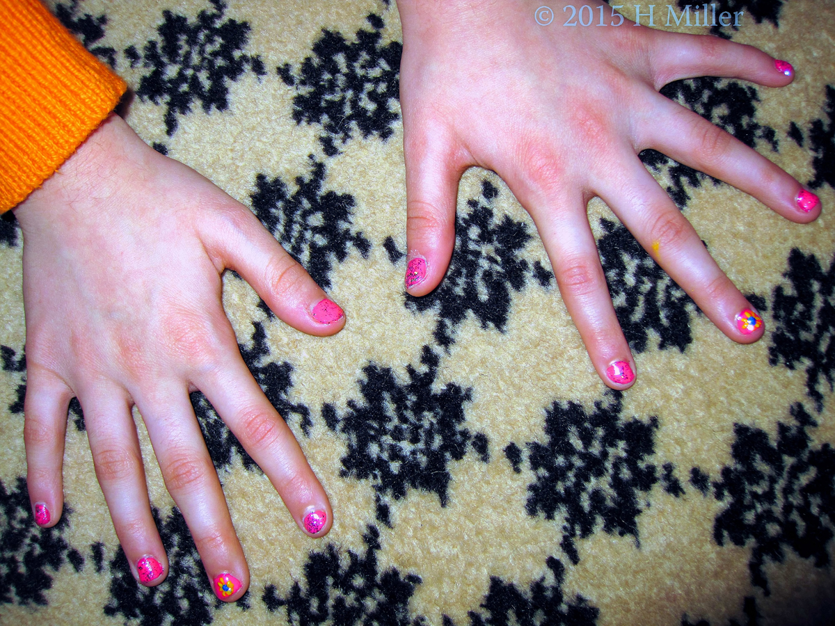 Bubble Gum Pink Nail Polish With Silver Glitter And A Yellow Ray Flower Graphic.