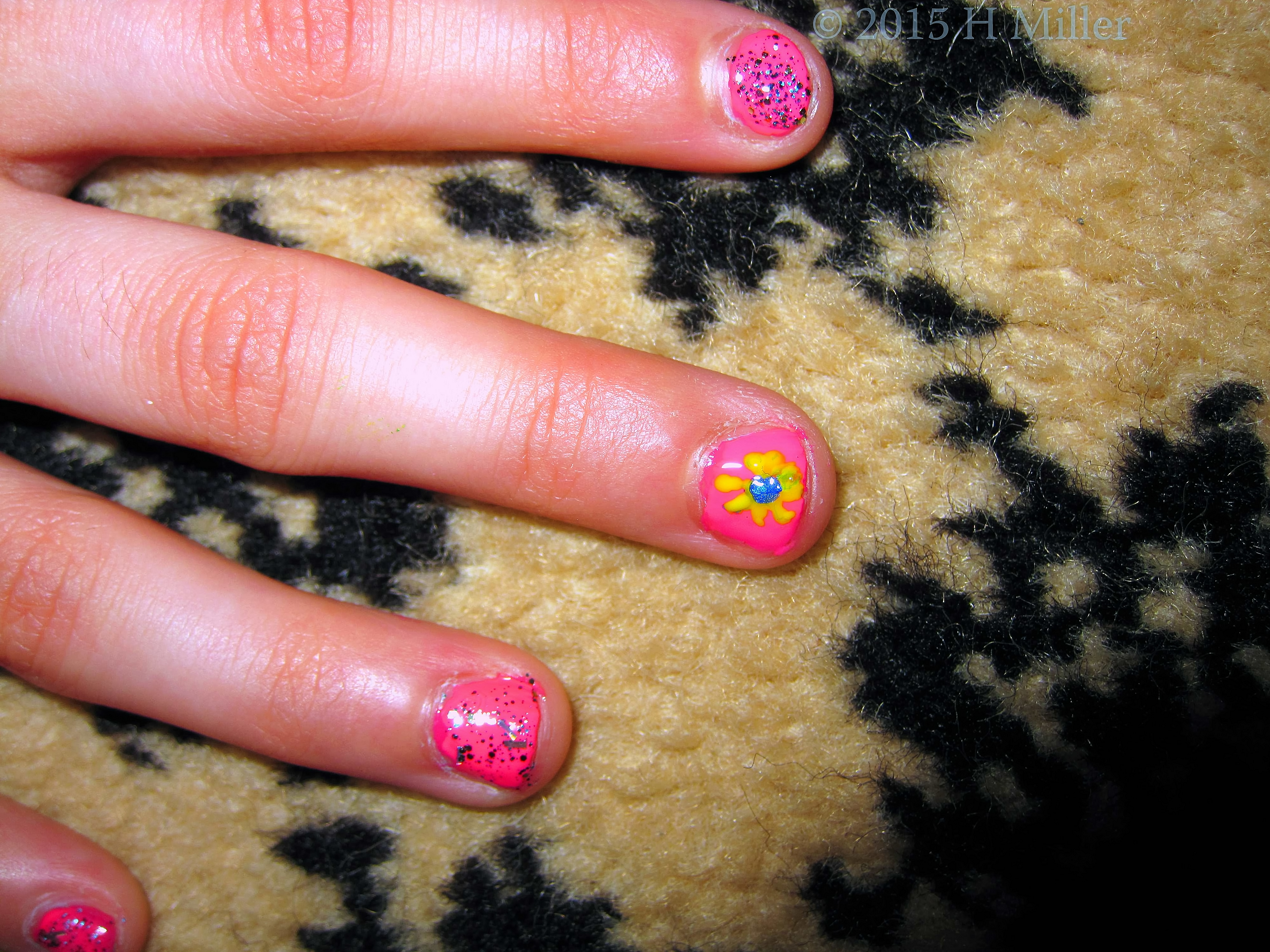 Closeup Of Nail Art Blue And Yellow Ray Flower.