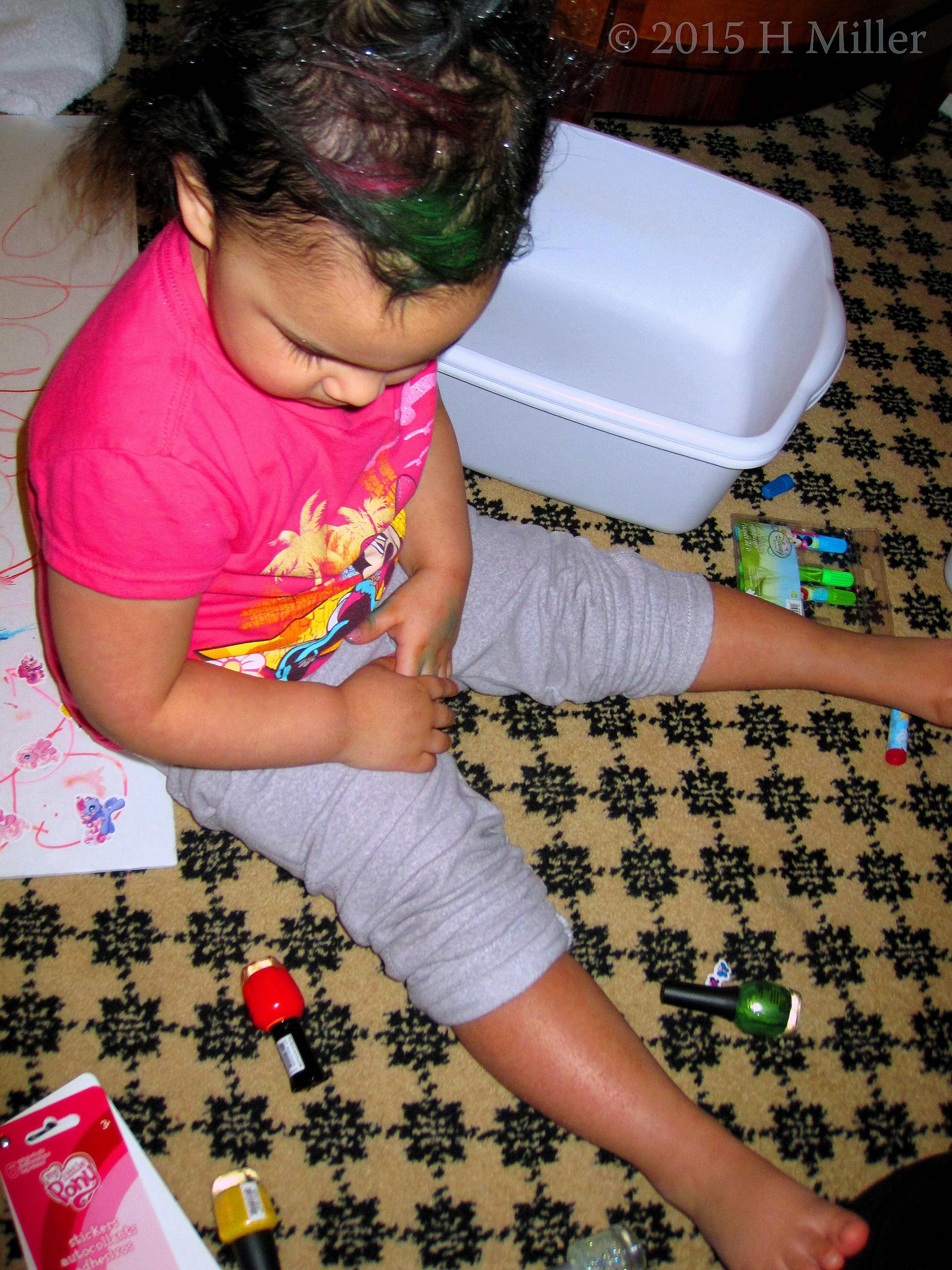The Baby Checking Out The Polish Bottles. The Baby Checking Out The Polish Bottles.