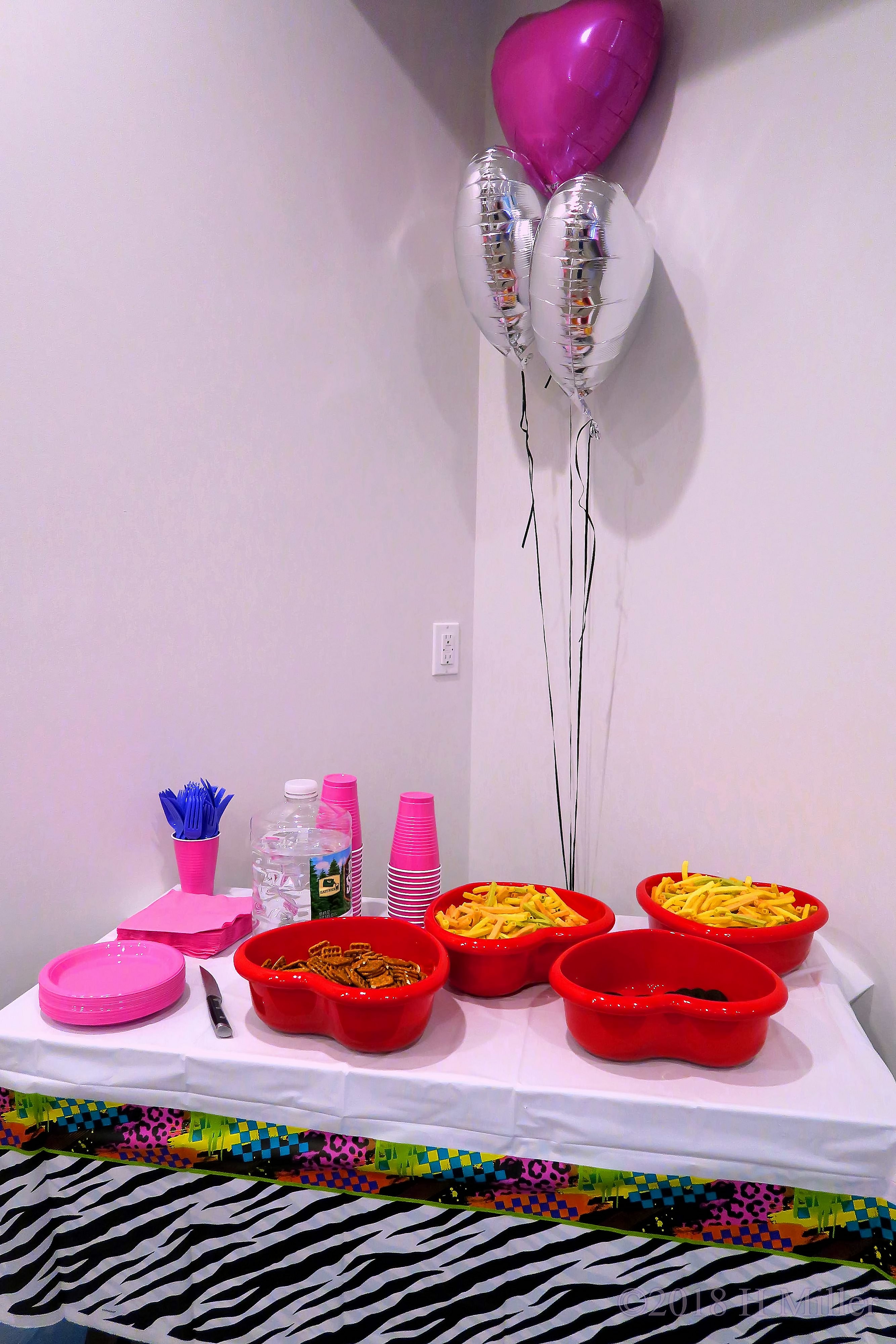 Snack Station With Beautifully Decorative Silver And Purple Balloons 