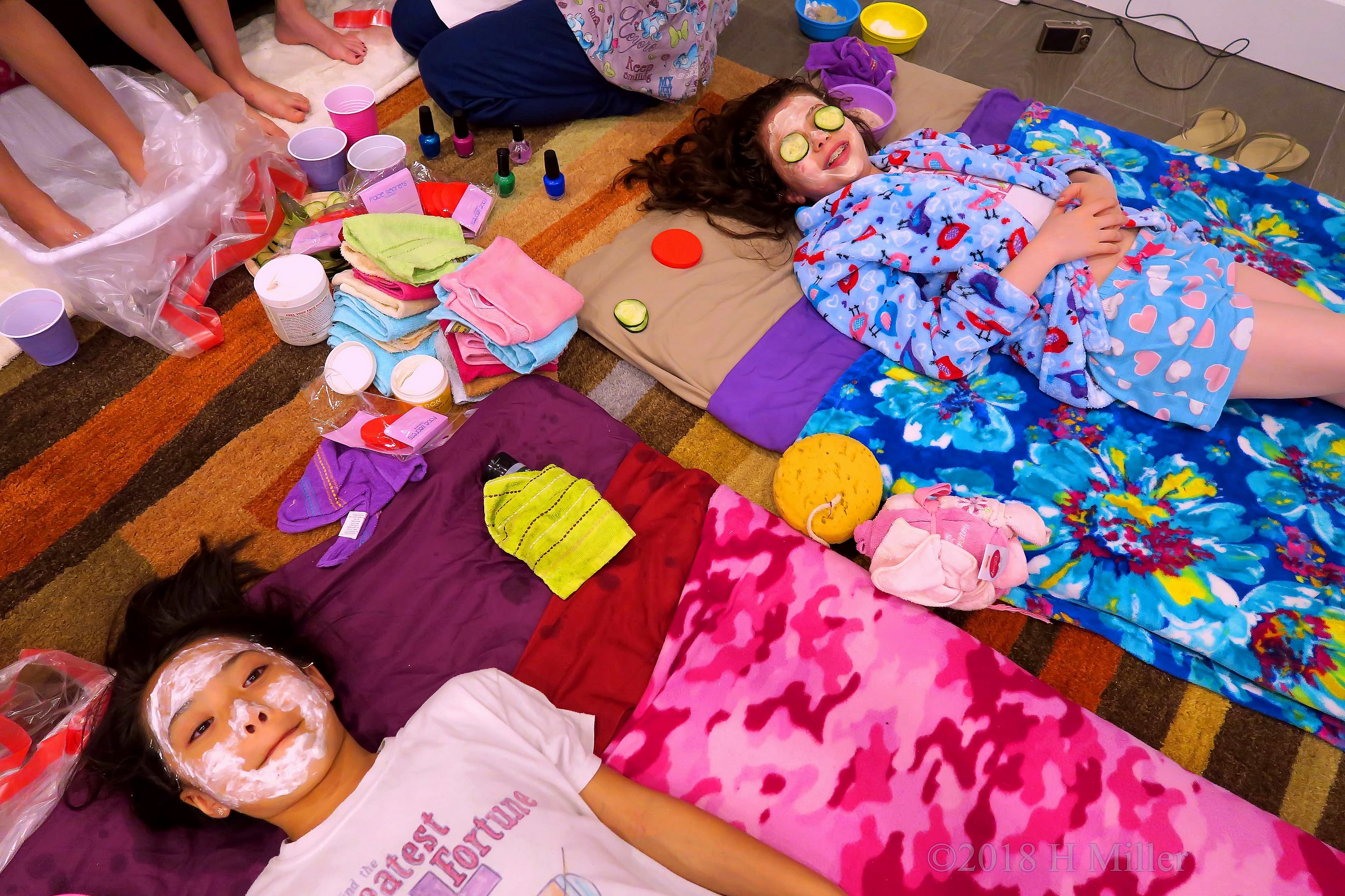 Spa Facial Station With Party Guests Getting Their Girls Facials Done Spa Facial Station With Party Guests Getting Their Girls Facials Done