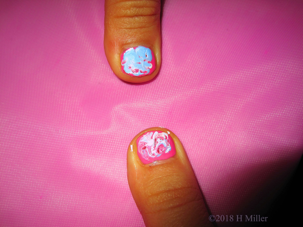 Pink Base Polish With Blue And White Swirl Nail Art 