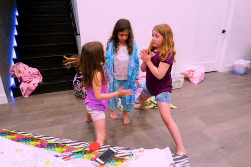 Party Guests Playing Games And Enjoying Themselves Party Guests Playing Games And Enjoying Themselves