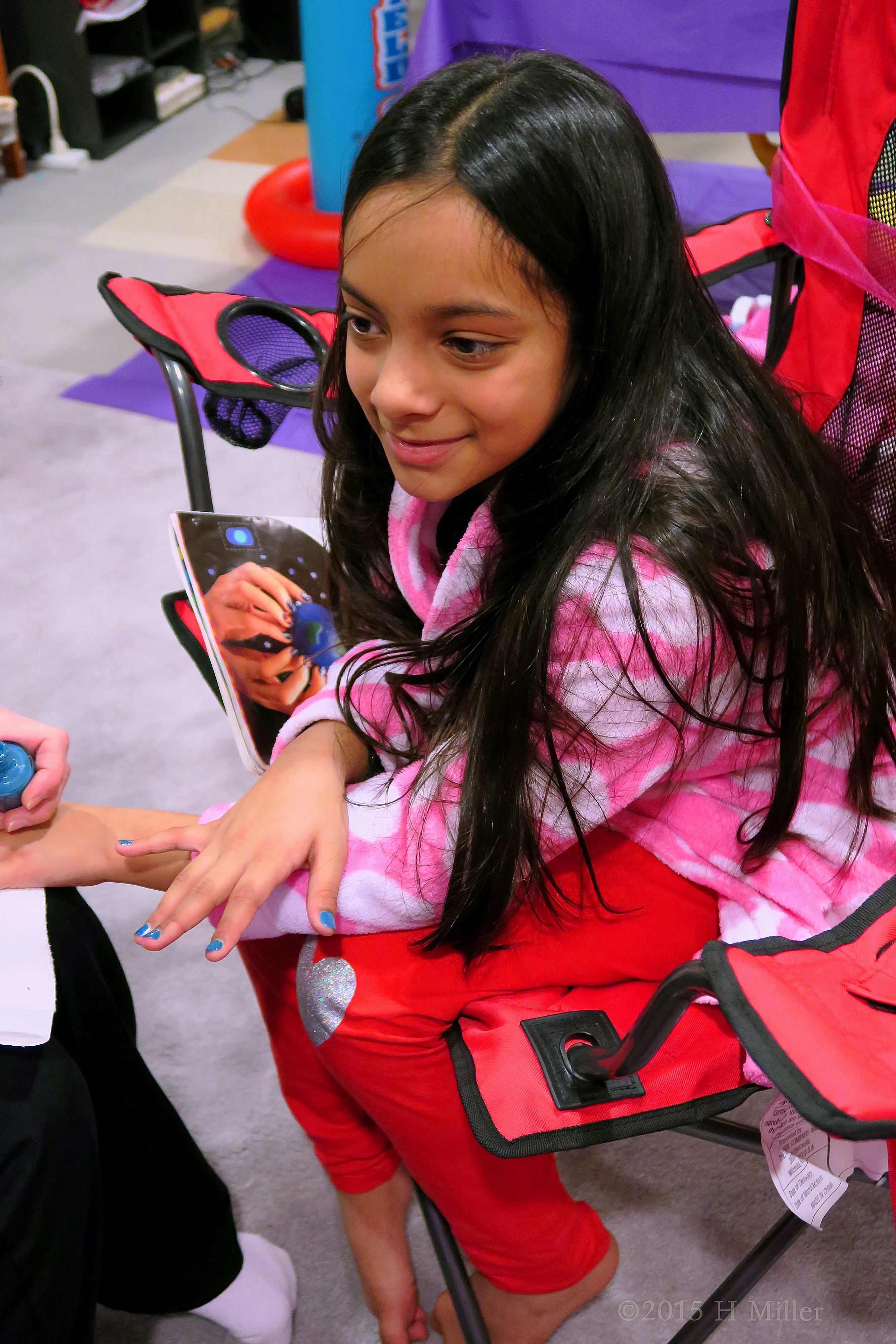 Having Her Nails Painted. 