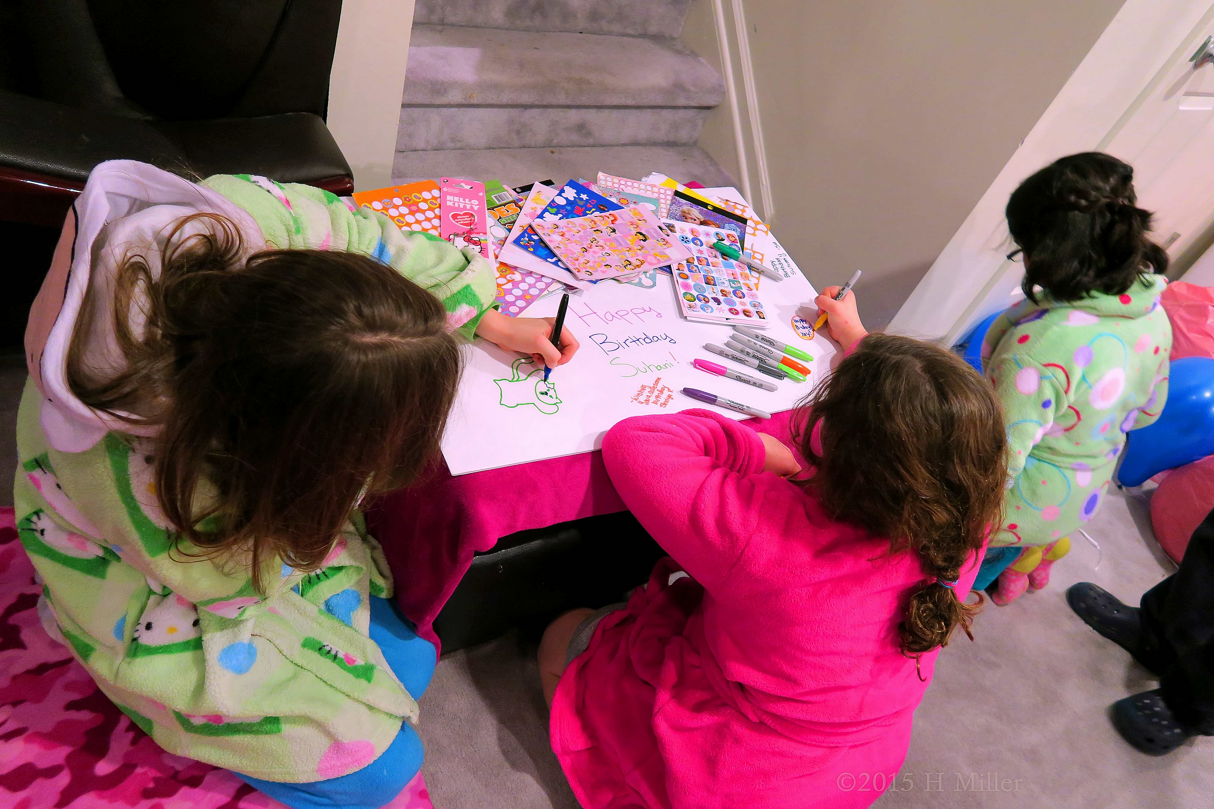 The Girls Writing Kind Words For Suhani On Her Spa Birthday Card. 