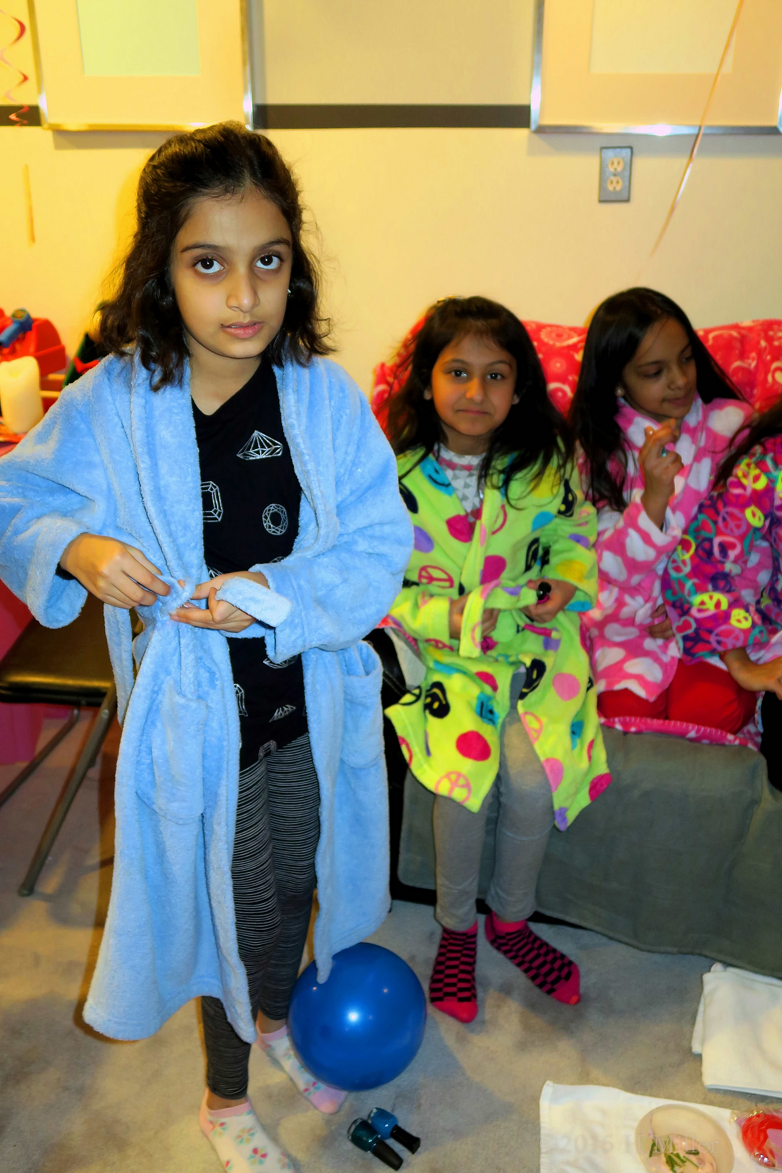 Tying The Sash On Her Spa Party Robe. Tying The Sash On Her Spa Party Robe.