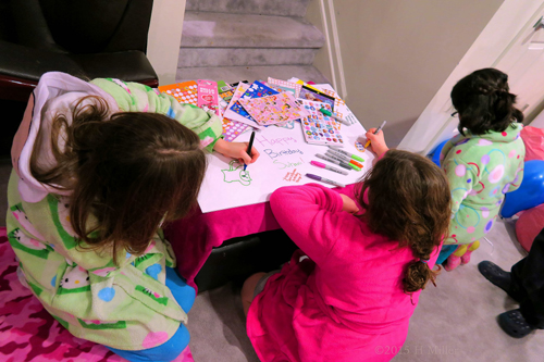 The Girls Writing Kind Words For Suhani On Her Spa Birthday Card.