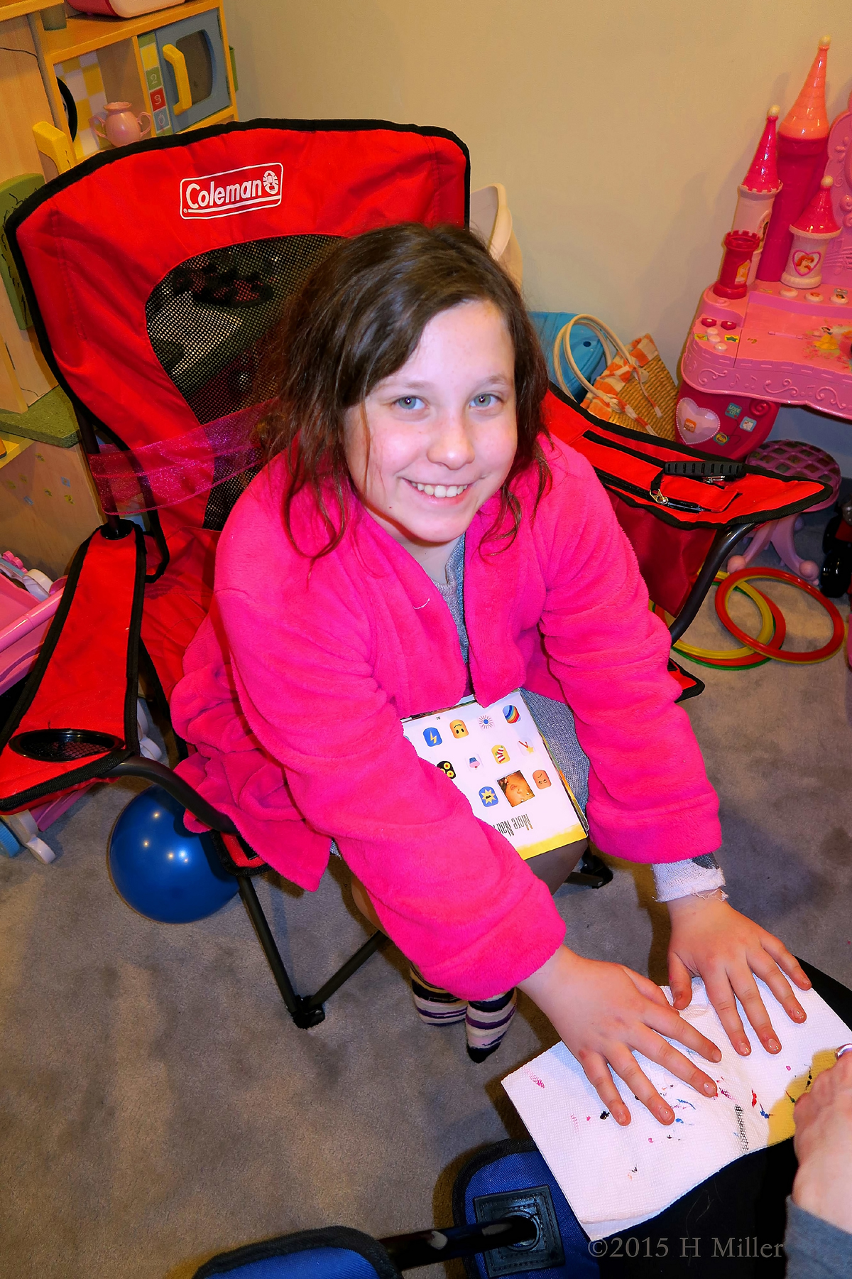 Smiling While Getting Her Kids Manicure 