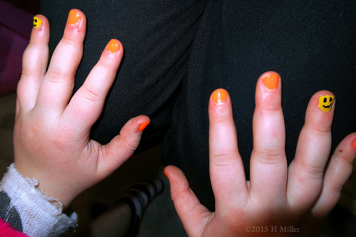 Bright Orange And Yellow Happy Face Nail Art