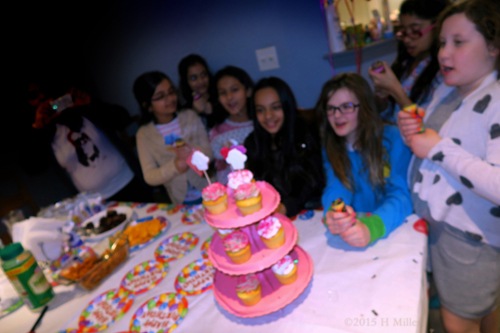 Girls Gathered Around Cupcakes! 