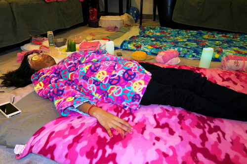 Wearing A Two Tone Face Mask, She's Enjoying Her Facial Wearing A Two Tone Face Mask, She's Enjoying Her Facial