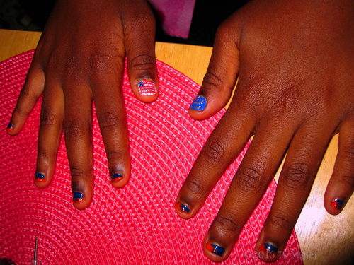 Blue And Orange Manicure With Nail Art Design Of American Flag