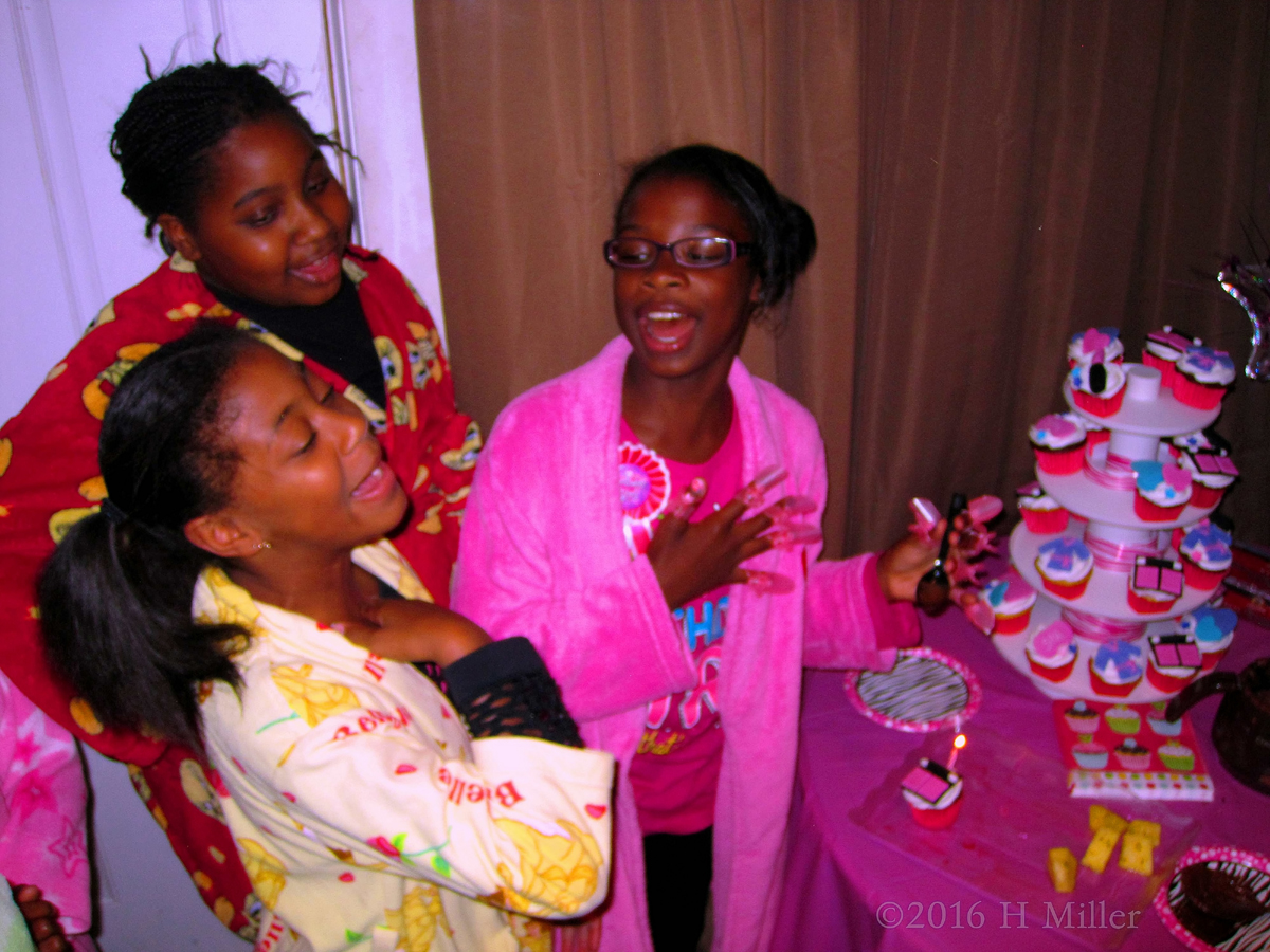 The Birthday Girl And Her Guests Having A Laugh While Getting Kids Spa Themed Cupcakes