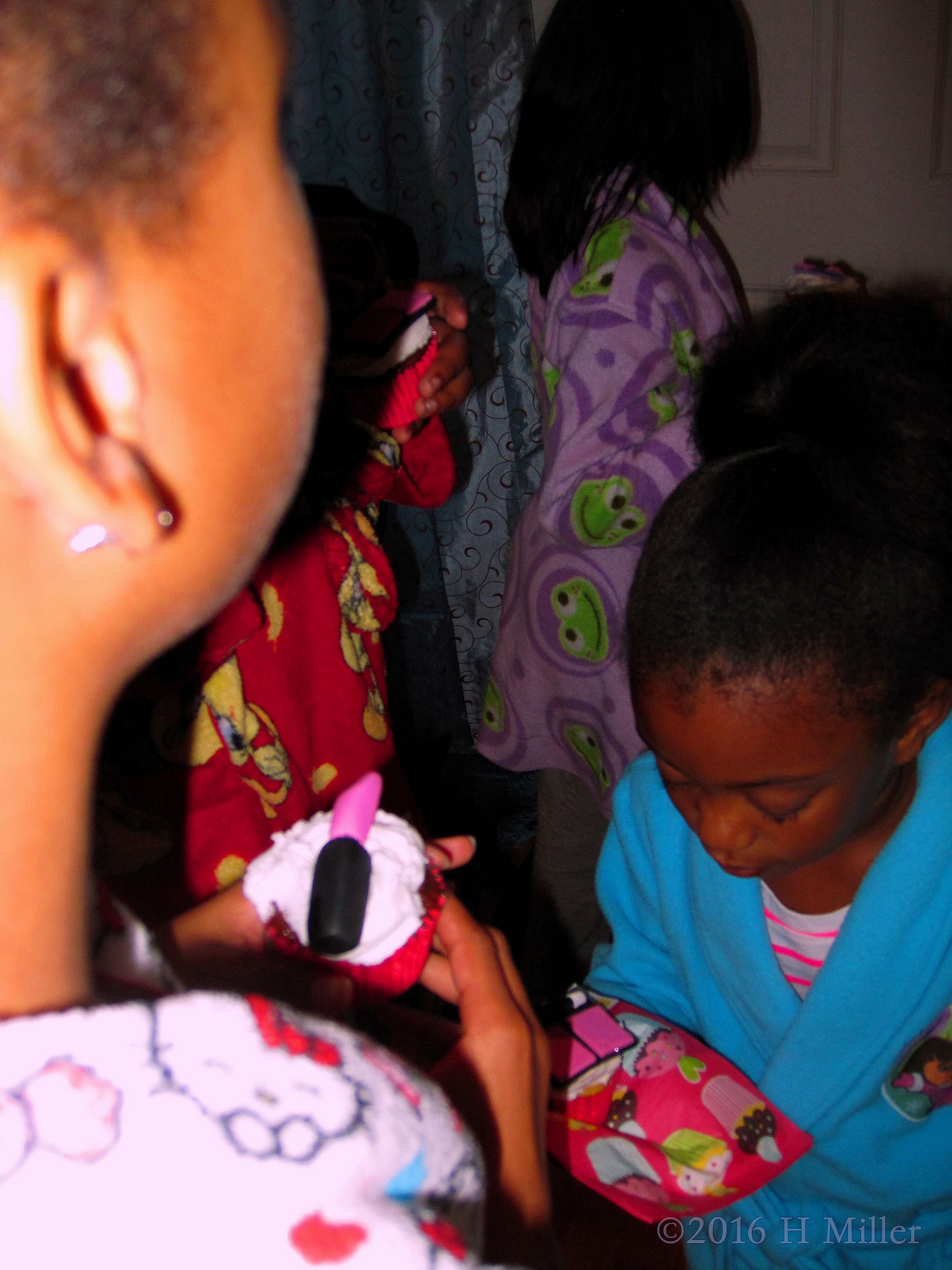 Party Guests Enjoying Their Cupcakes! Party Guests Enjoying Their Cupcakes!