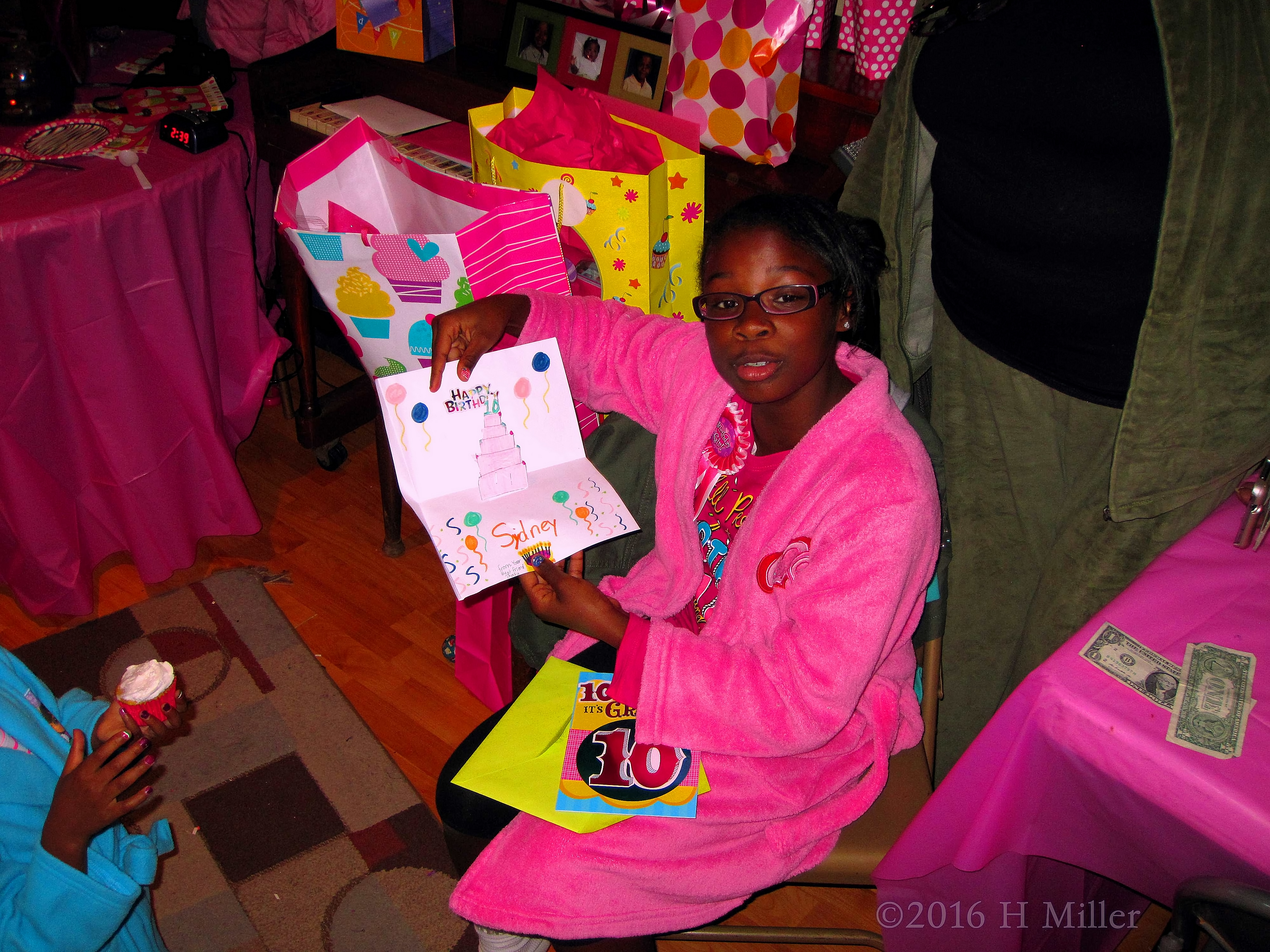 The Birthday Girl Showing A Card She Received 