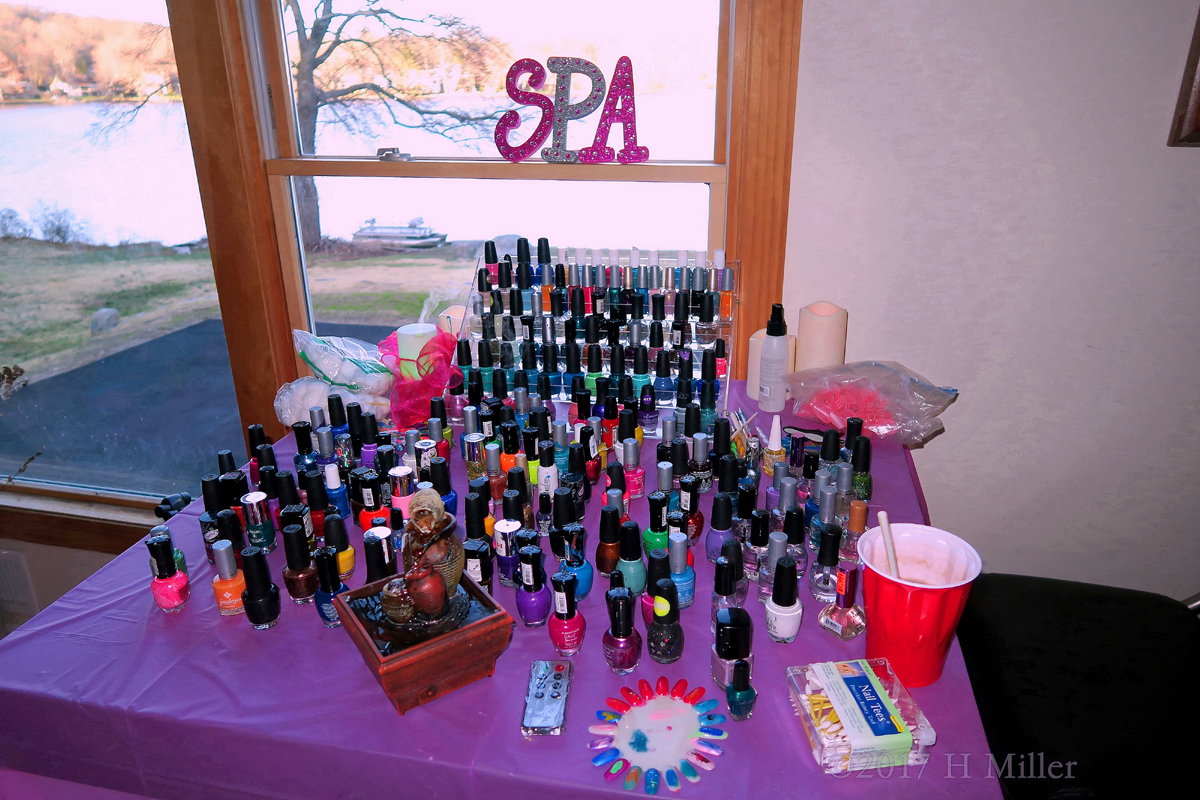 Nail Art Station Showcasing A Wide Collection Of Nail Polishes For Girls Manicures, And The Signature Spa Sign