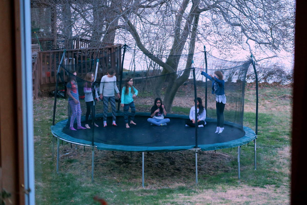 Party Guests Jumping Around On The Trampoline At Tessa's Spa Party