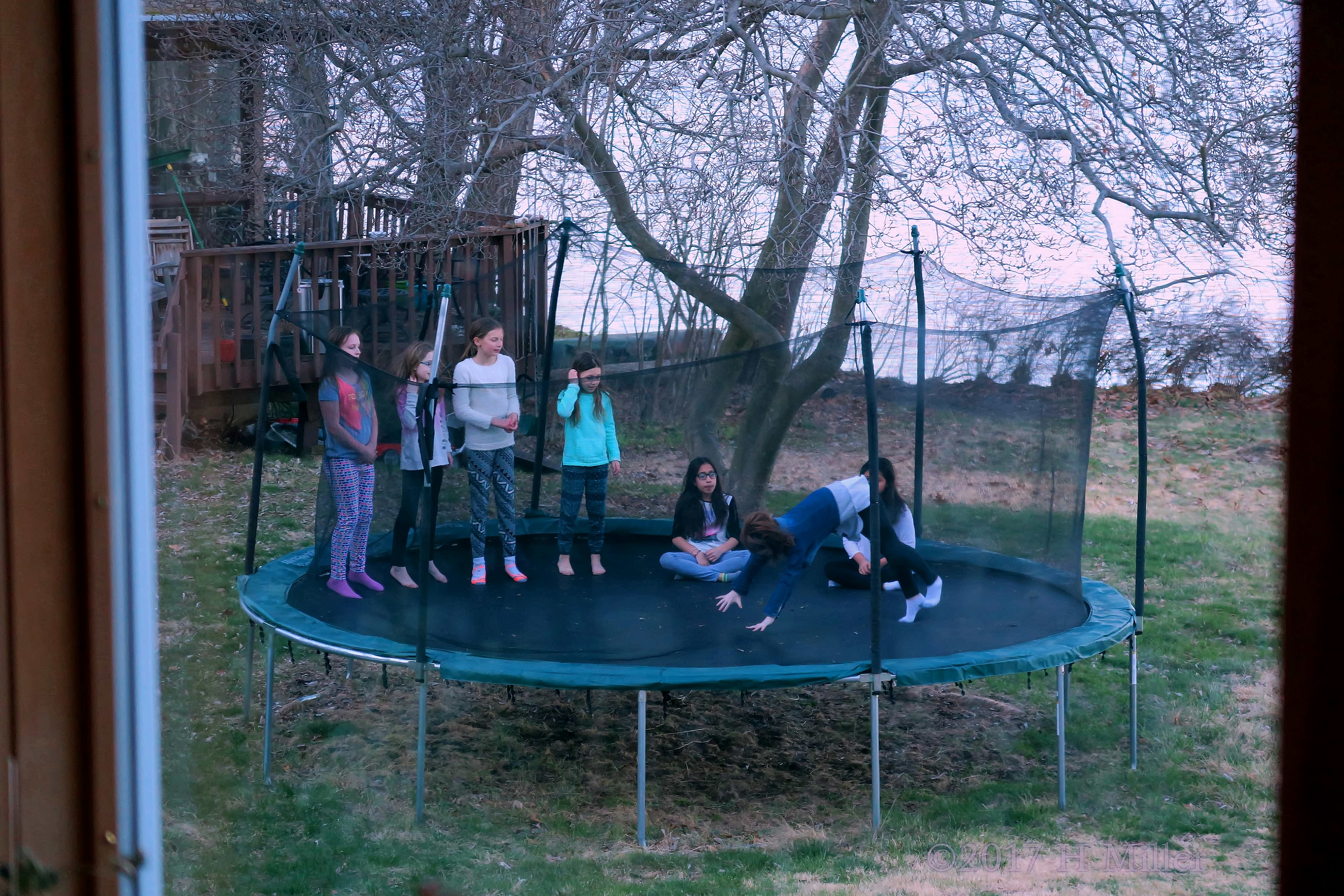 Party Guests Chilling Outdoors Overlooking A Tranquil Backdrop Party Guests Chilling Outdoors Overlooking A Tranquil Backdrop