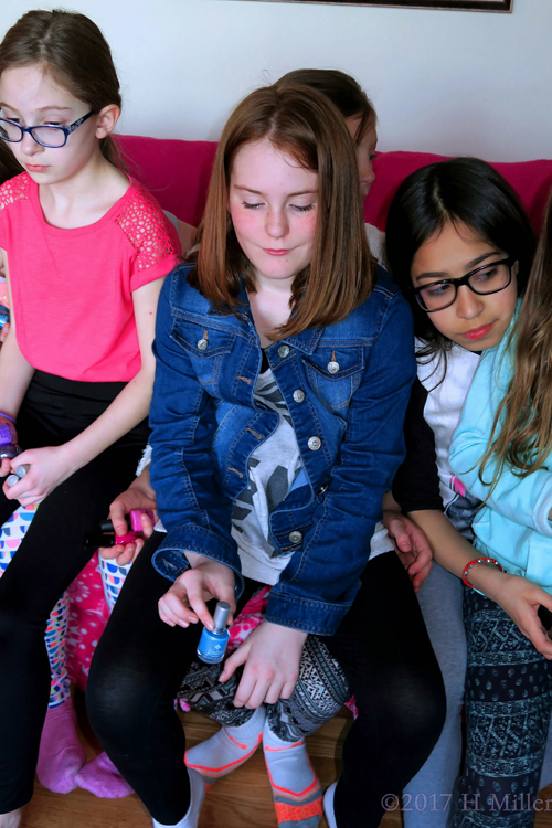 This Guest Showing Off Her Blue Polish For Her Kids Manicure