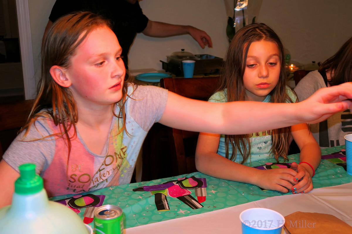 The Birthday Girl And Friend Choosing Their Kids Spa Cupcake 