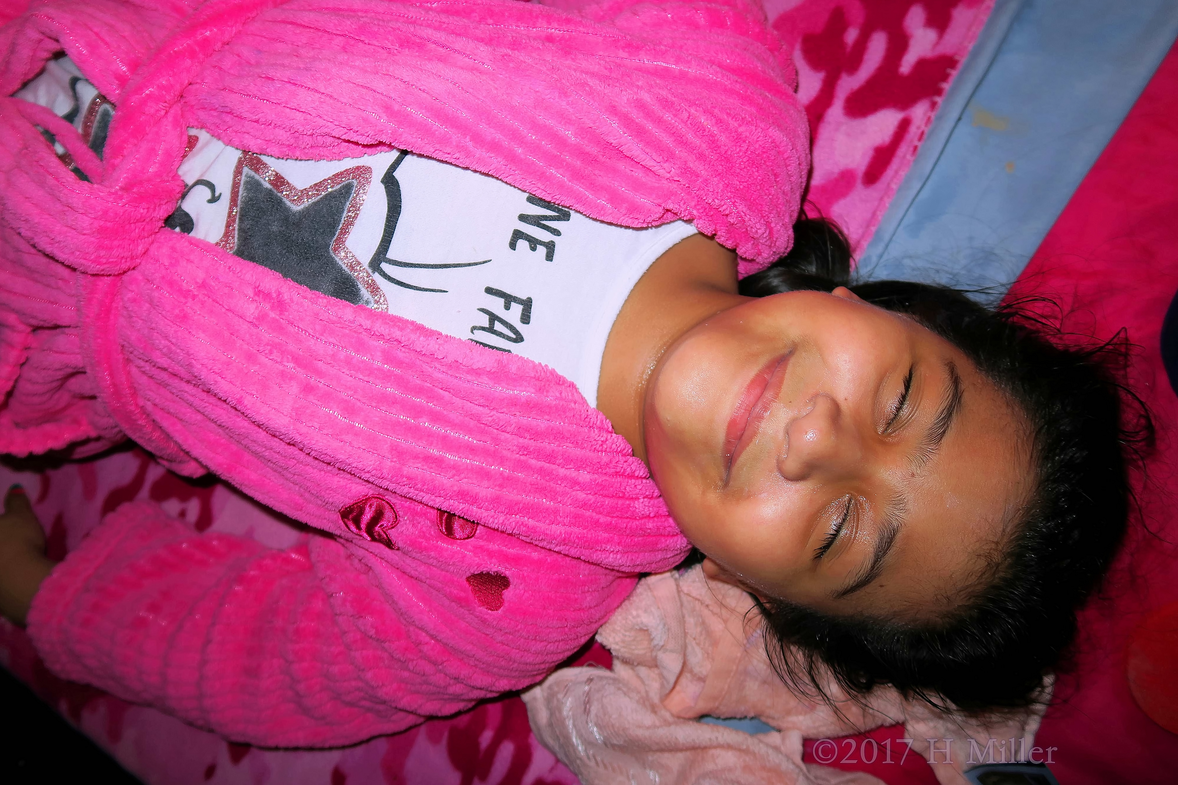 Party Guest Relaxing In Her Comfy Pink Spa Robe At The Girls Facial Station Party Guest Relaxing In Her Comfy Pink Spa Robe At The Girls Facial Station