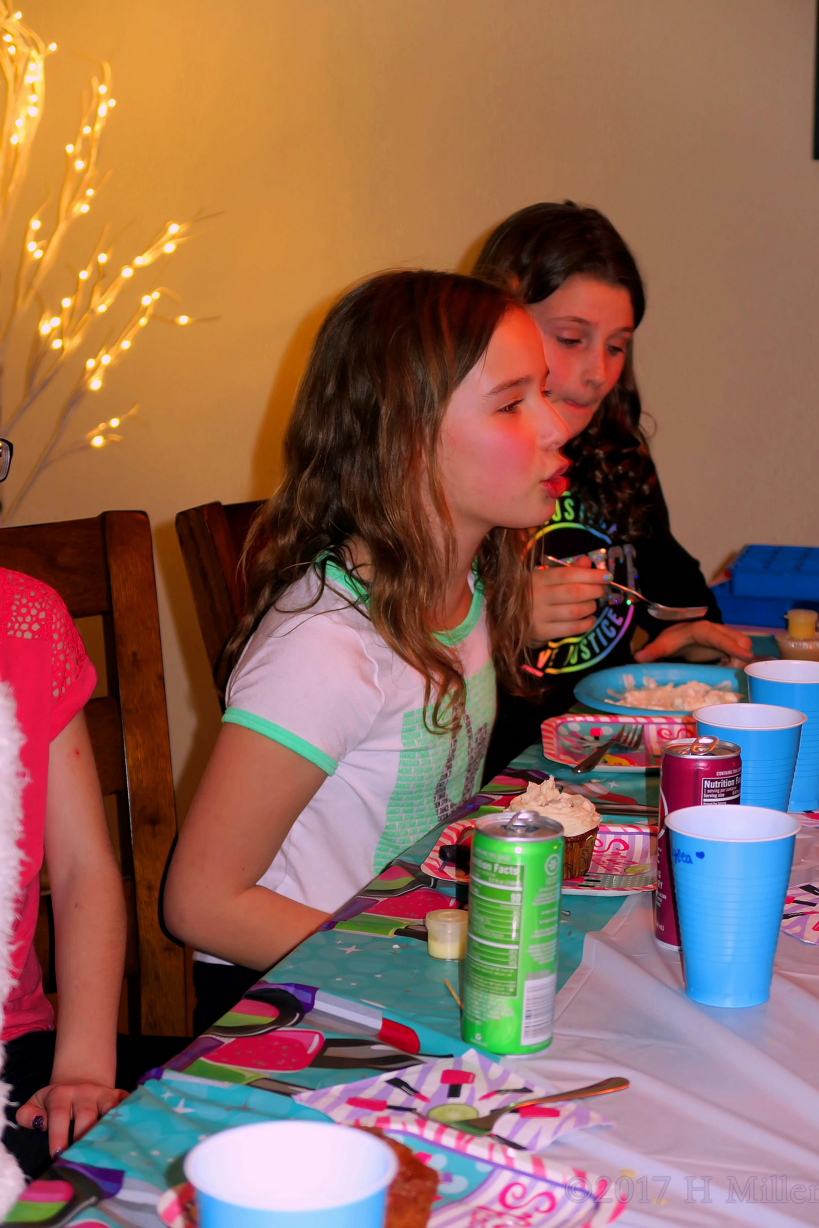 Party Guests Enjoy Cake And Party Treats 