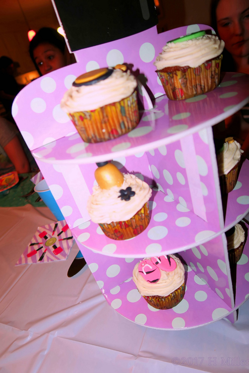Close Up Shots Of The Beautifully Decorated Cupcakes