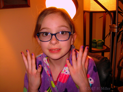 Party Guest Showing Off Her Colorful Girls Manicure 