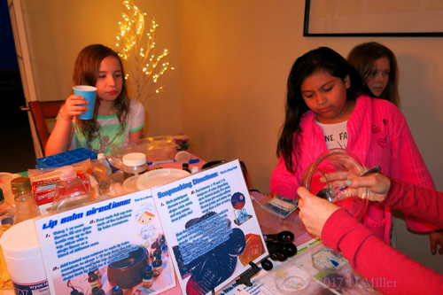 Party Guests Gater Round At Kids Craft Statio Party Guests Gater Round At Kids Craft Statio