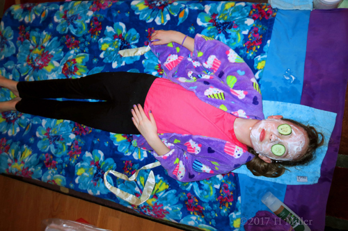 Wide Shot Of Party Guest At The Girls Facial Station Wide Shot Of Party Guest At The Girls Facial Station