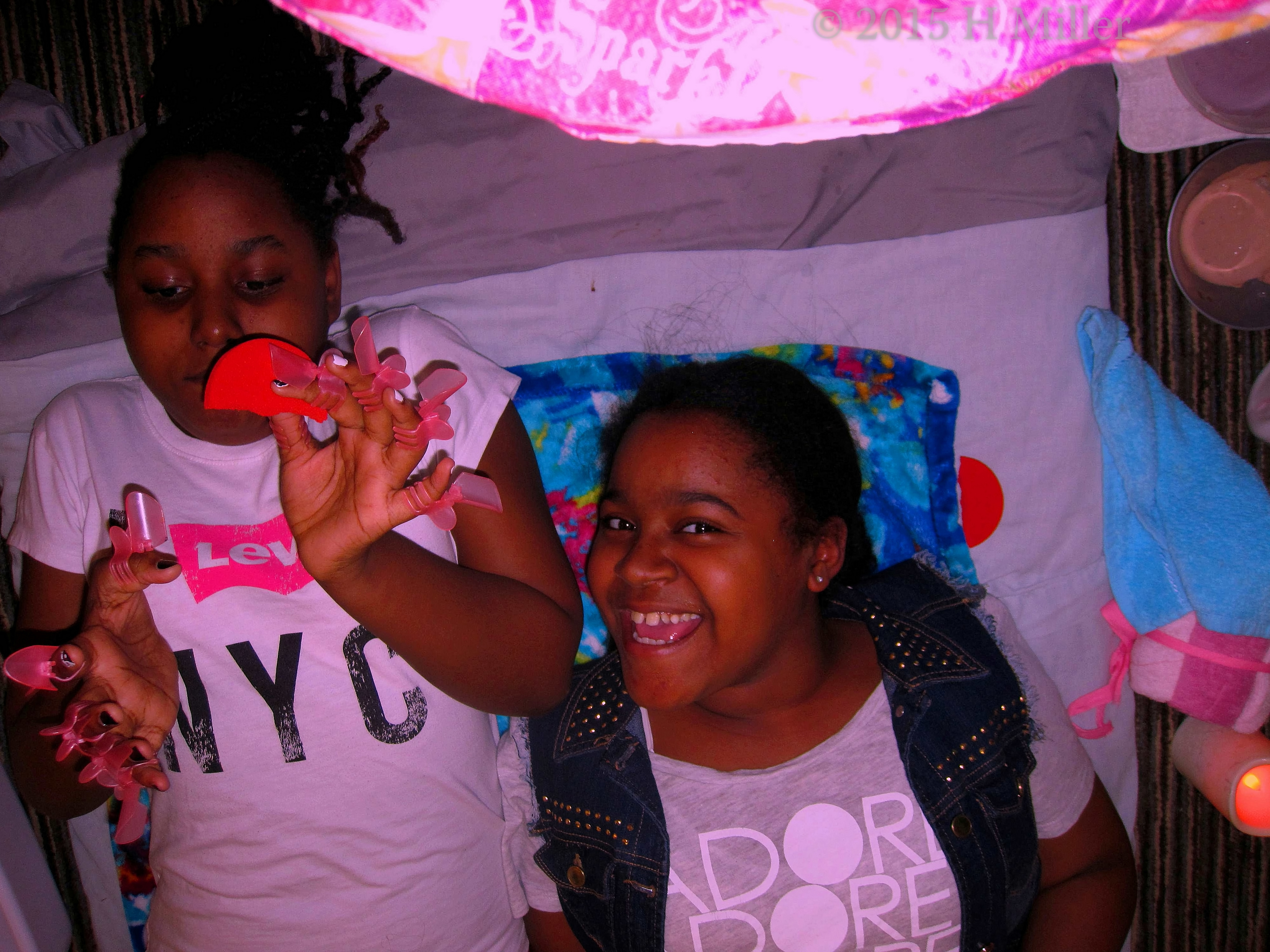Nail Protectors On Her Hands. The Girls Are Ready For Their Masques. Nail Protectors On Her Hands. The Girls Are Ready For Their Masques.