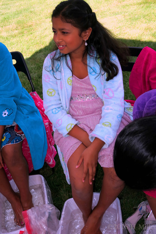 Talking To Her Friends And Relaxing During Kids Pedicures. Talking To Her Friends And Relaxing During Kids Pedicures.
