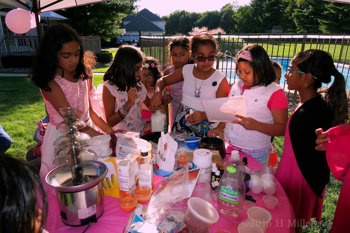 Girls Helping Each Other To Make Bath Salts And Soaps For Kids Crafts Projects. 